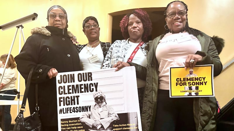 Eddie Mae Ellison, Jackie Bradford, Mary Bradford and Lois Harris hold signs urging Alabama...