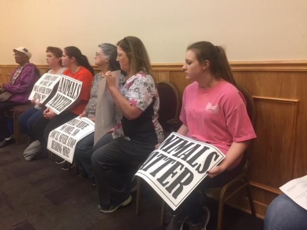 Supporters of the Humane Society held “animals matter” signs signs as Susan Allen addressed...