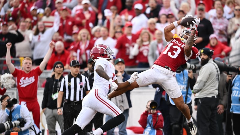 Indiana wide receiver Elijah Sarratt (13) makes a touchdown catch past Alabama defensive back...