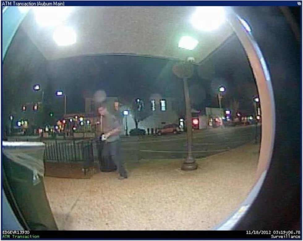 Video of a "person of interest" in the Toomer's Corner tree fire, captured by a nearby bank's...