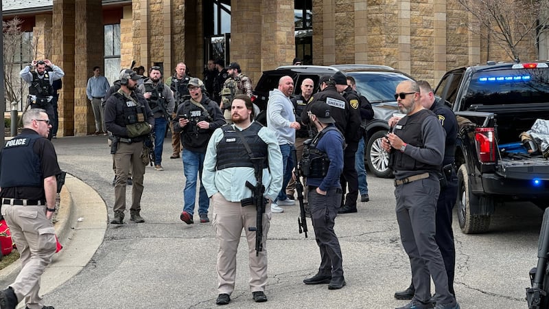 Law enforcement respond to a call at Temple Israel synagogue, Thursday, March 12, 2026 in West...