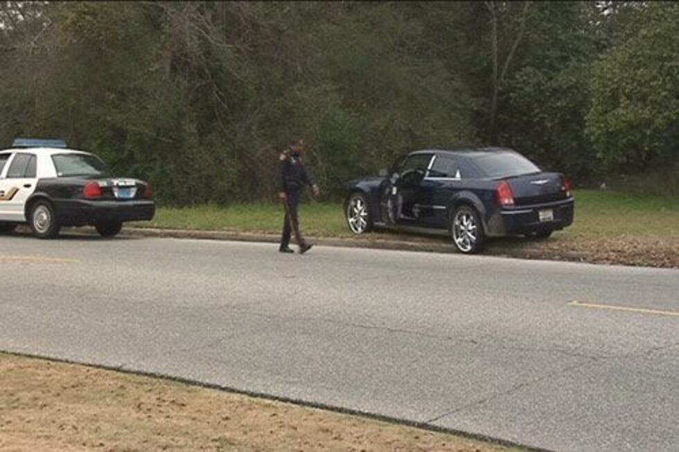 Suspects' car after bailing out a short distance from the mall.