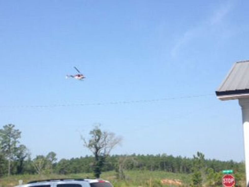 A Dale Co. Sheriff's helicopter helps in a Henry Co. manhunt.