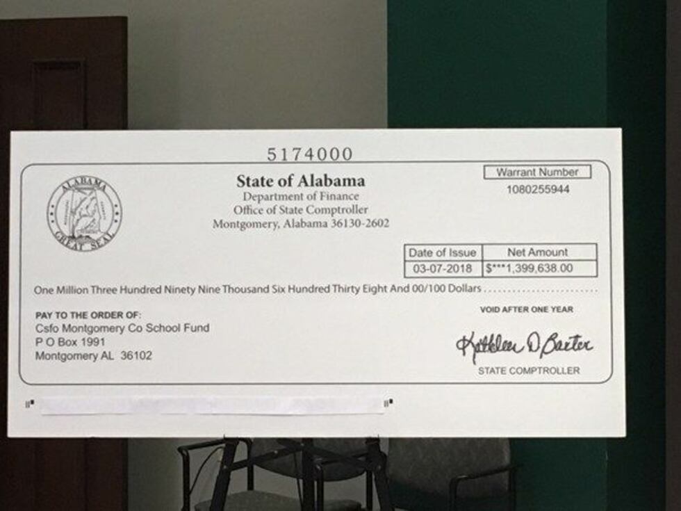 AEA displayed a blownup version of the check during a Monday afternoon news conference....