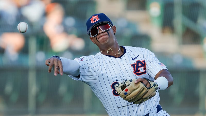 Auburn's Eric Guevara (8) throws to first base during an NCAA baseball game against Alabama...