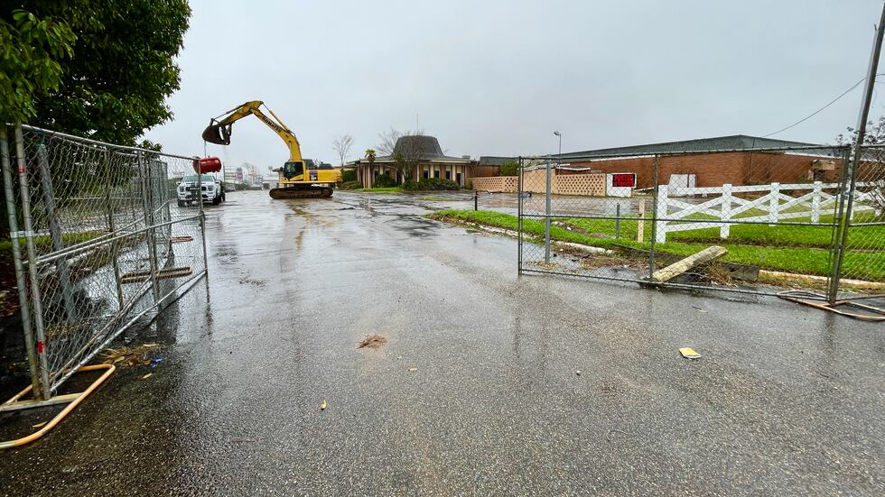A bulldozer begins the process of demolishing the old Governor's House Hotel in Montgomery....