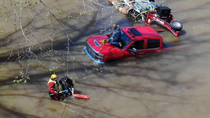Two men rescued after truck is swept away by flood waters in Alabama
