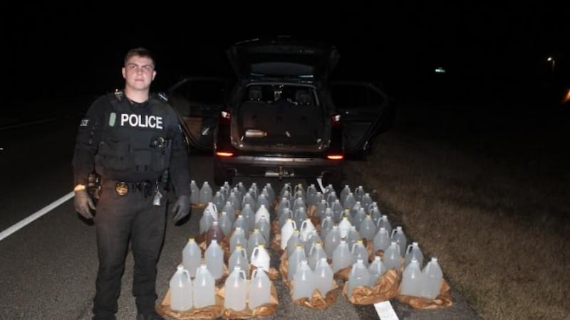 Ozark Police Officer Dylan Griffin uncovered over 81 gallons of illegally distilled moonshine...
