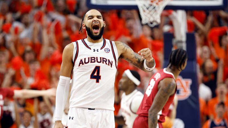 Auburn forward Johni Broome reacts after a basket during the first half of an NCAA college...